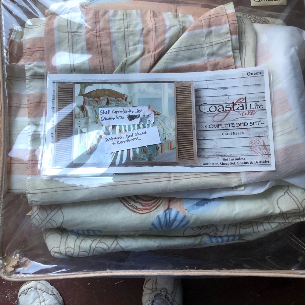 She queen comforter, shams, bed skirt. Coral